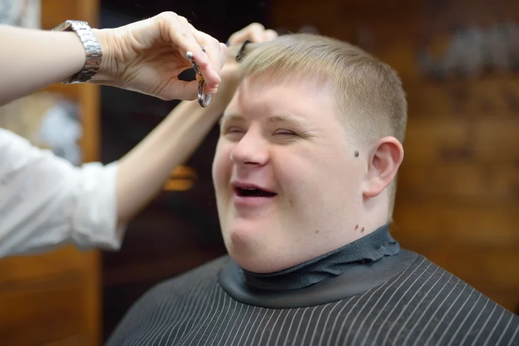 Disabled man getting haircut